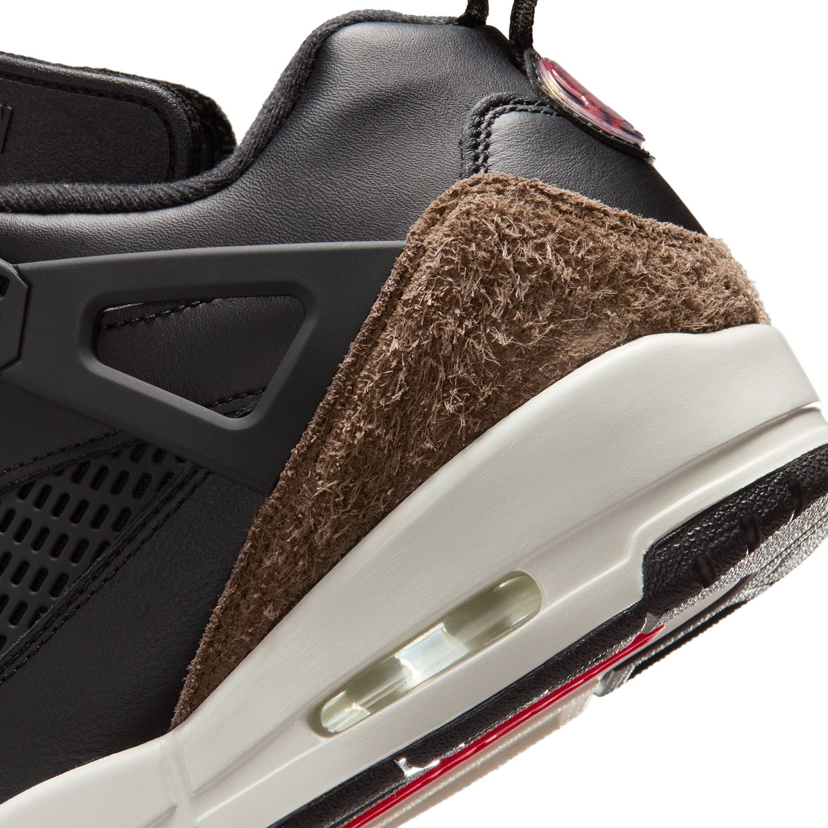 Men's Air Jordan Spizike Low sneakers in black and university red, showcasing the stylish design and athletic footwear features.
