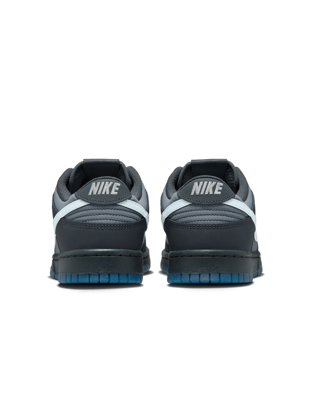 Nike Men's Dunk Low Pure Platinum sneakers, denim exchange branded footwear with sleek silver and white design, shown from side view.