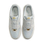 Nike men's Air Force 1 '07 LV8 sneakers in Light Smoke Grey, side view with classic low-top design