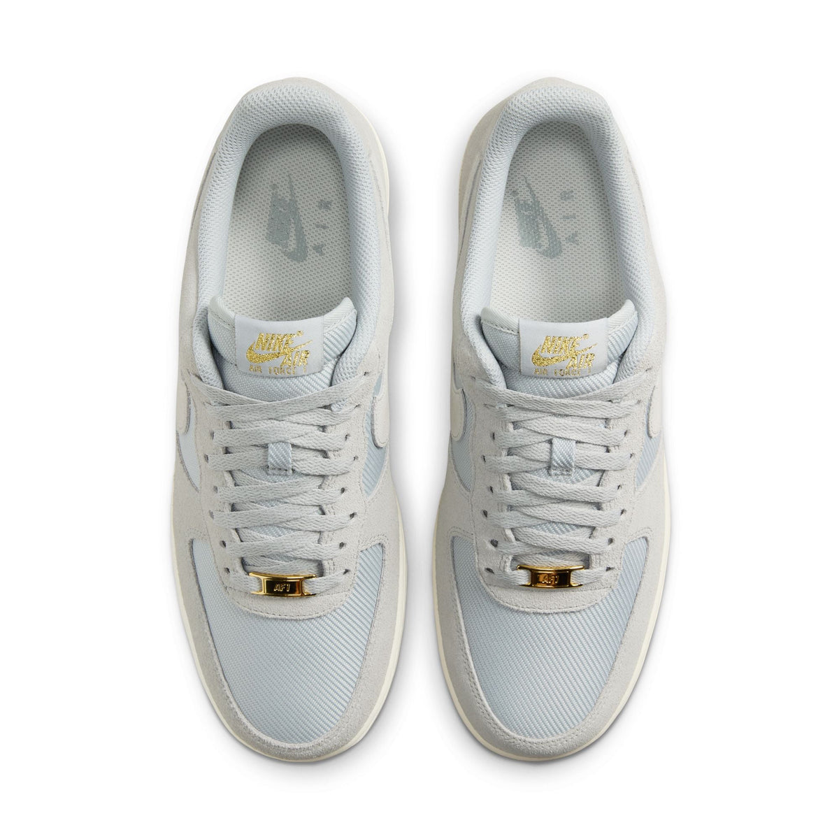 Nike men's Air Force 1 '07 LV8 sneakers in Light Smoke Grey, side view with classic low-top design