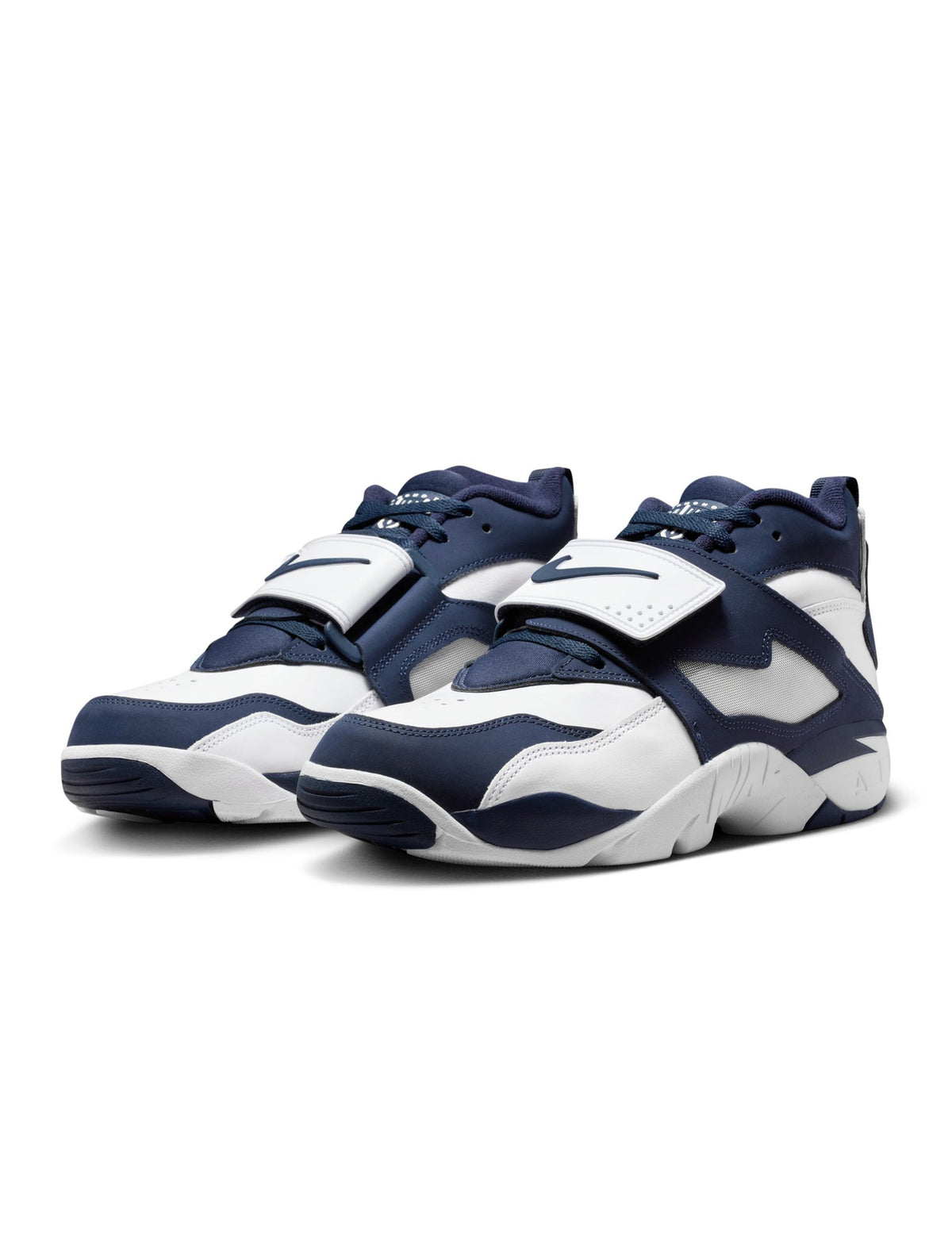 Nike men's Air Diamond Turf Cowboys footwear in white and navy with Nike branding and athletic design.