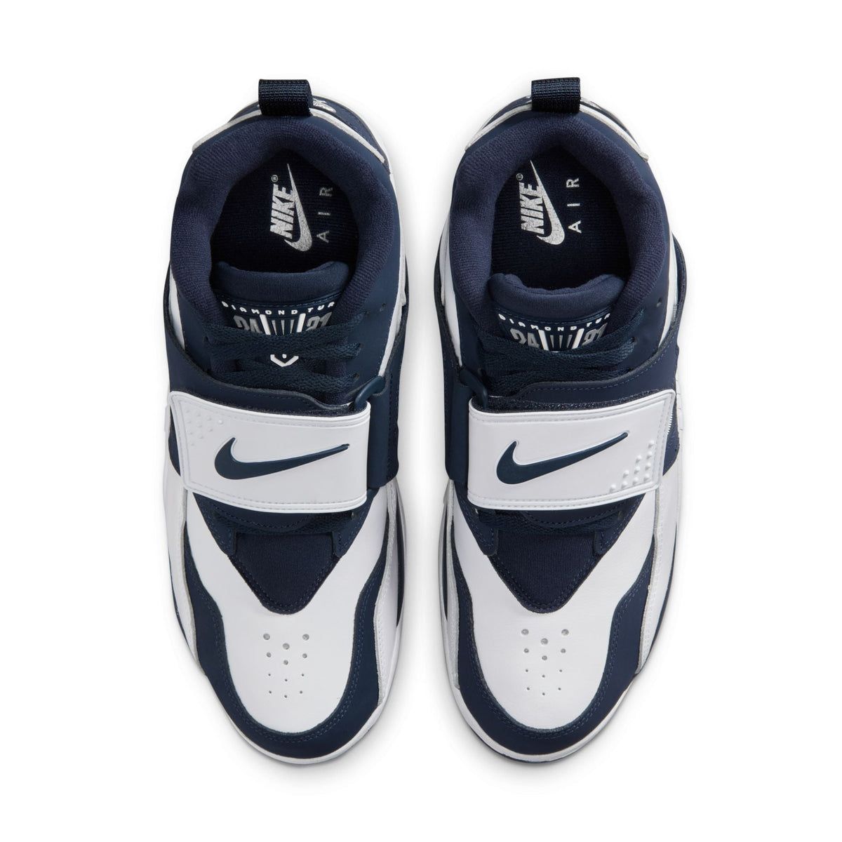 Nike men's Air Diamond Turf Cowboys sneakers, showcasing navy and white athletic footwear with Nike branding and retro design.