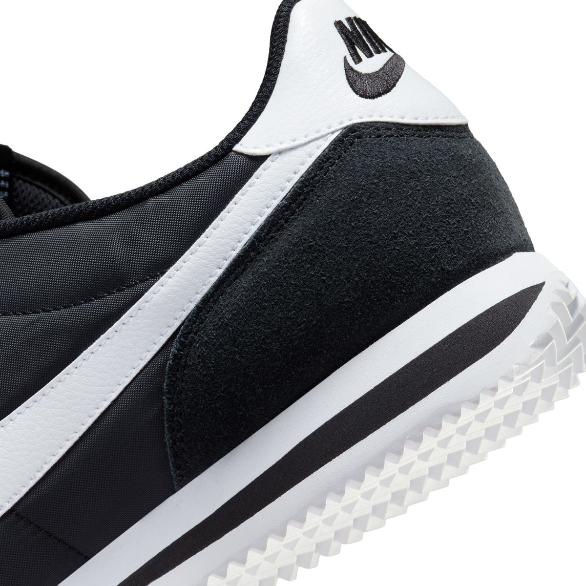 Nike men's Cortez TXT black and white sneakers from Denim Exchange, side view