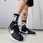 Nike Men's Cortez TXT black and white sneakers by Denim Exchange, side view