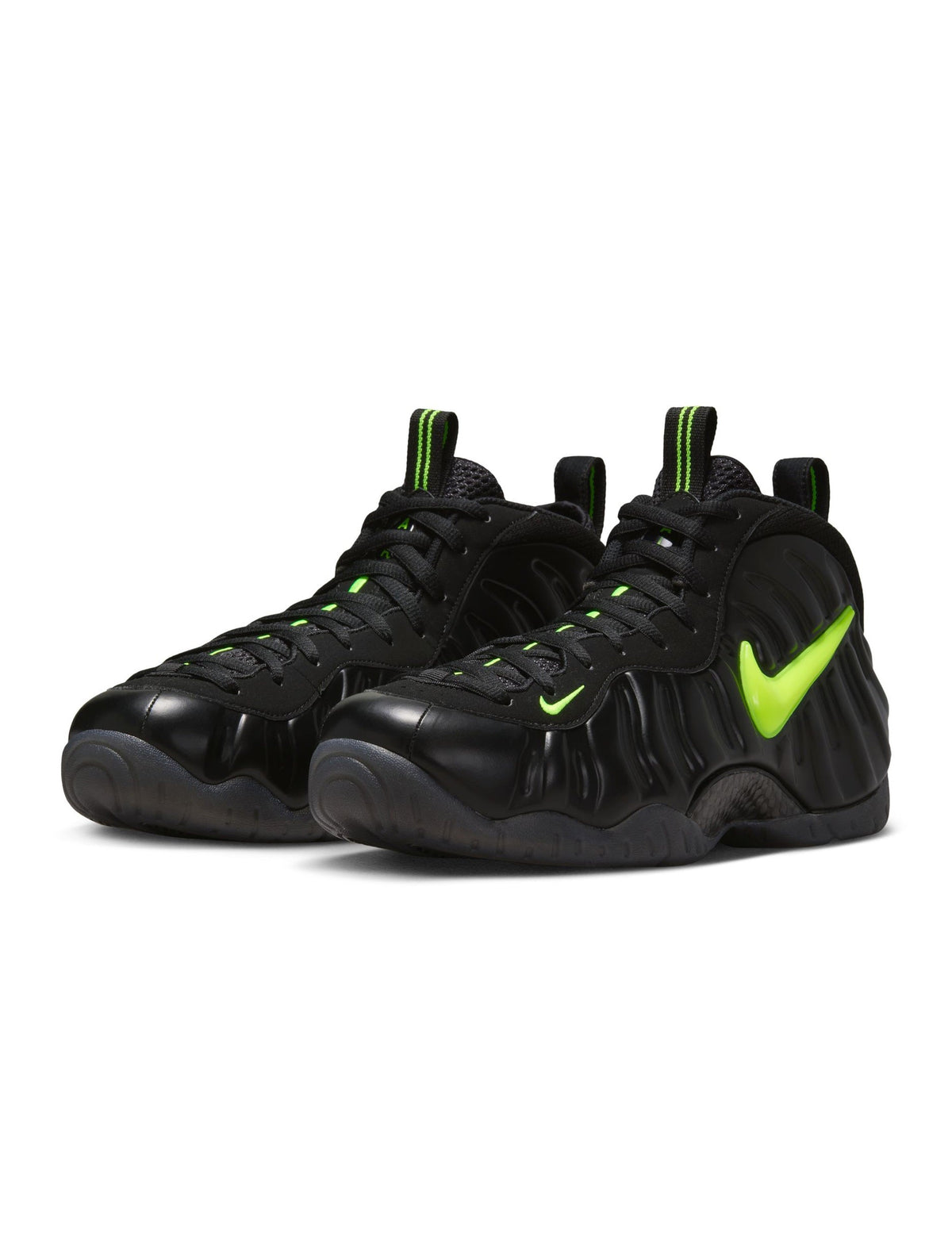 Nike Men's Air Foamposite Pro black and Voltage sneakers, showcasing the sleek design and bold color accents.
