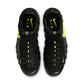 Nike men's Air Foamposite Pro sneakers in black and voltage with a sleek design and bold color accents.