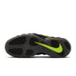 Nike men's Air Foamposite Pro sneakers in black and Voltage, showcasing the sleek design and textured upper.