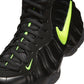 Nike men's Air Foamposite Pro sneakers in black and voltage, featuring a sleek design and durable construction.