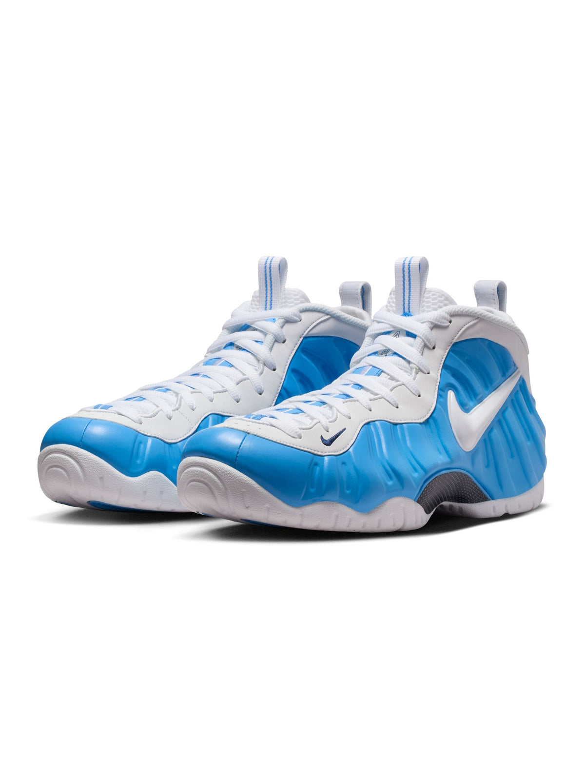 Nike men's Air Foamposite Pro sneakers in University Blue, featuring a sleek design and bold colorway.