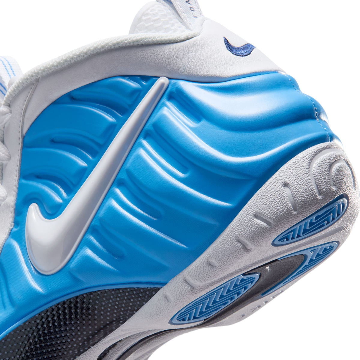 Nike men's Air Foamposite Pro sneakers in University Blue, showcasing the sleek design and vibrant colorway.