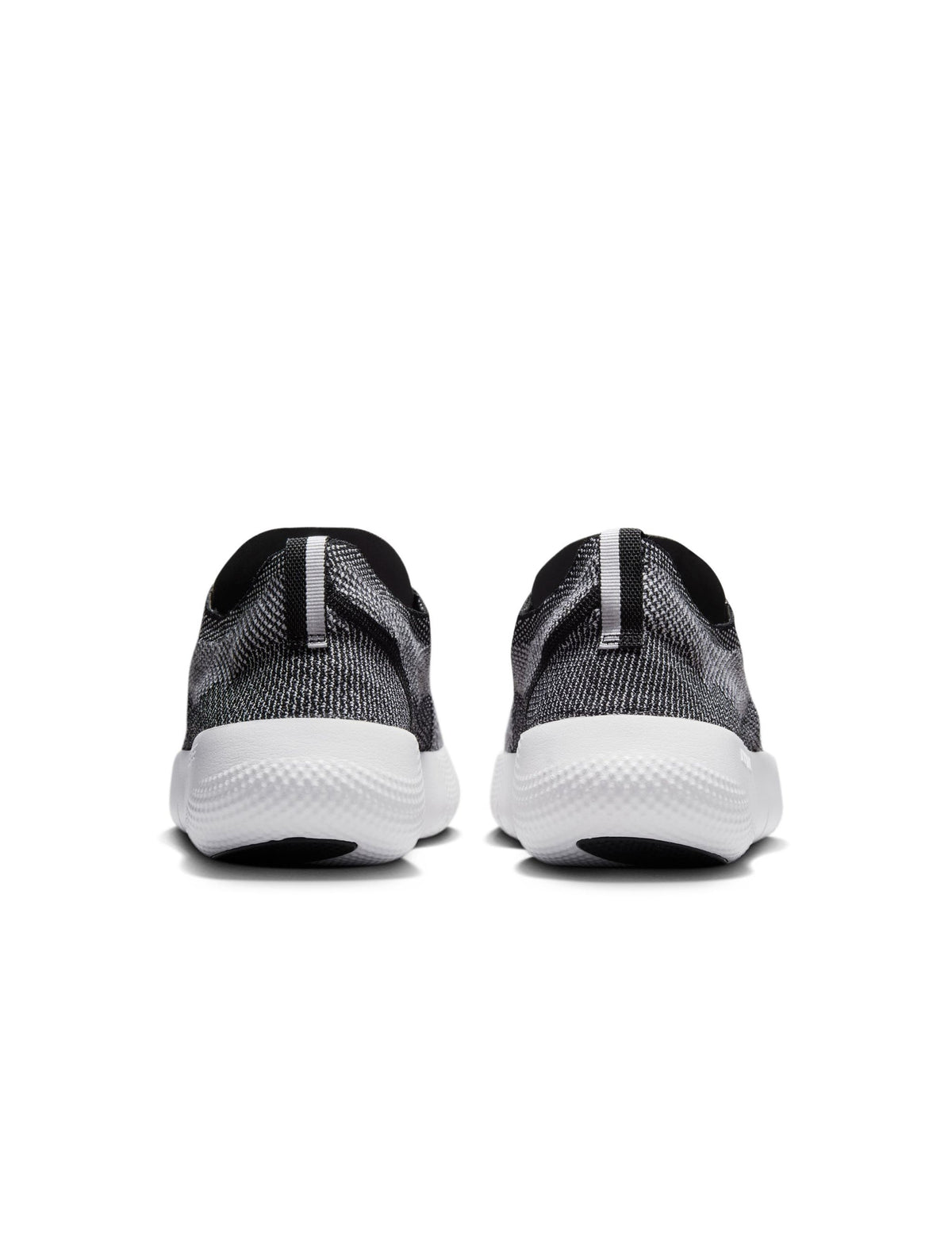 Nike men's Free 2025 sneakers in black and white, athletic footwear with breathable design and cushioned sole.