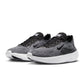 Black and white Nike men's Free 2025 sneakers featuring sleek design and breathable material, displayed on a neutral background.