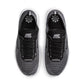 Nike men's Free 2025 black and white athletic footwear, showcased with side view highlighting the design and branding.
