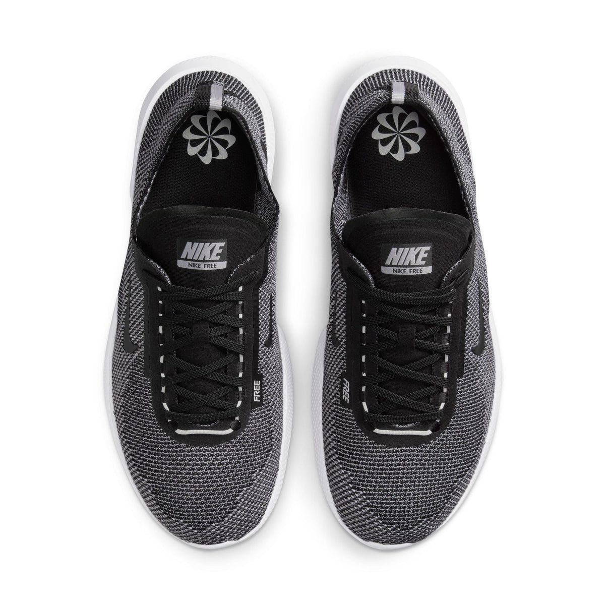 Nike men's Free 2025 black and white athletic footwear, showcased with side view highlighting the design and branding.
