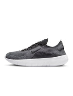Nike men's Free 2025 sneakers in black and white, lightweight athletic footwear with a modern design.