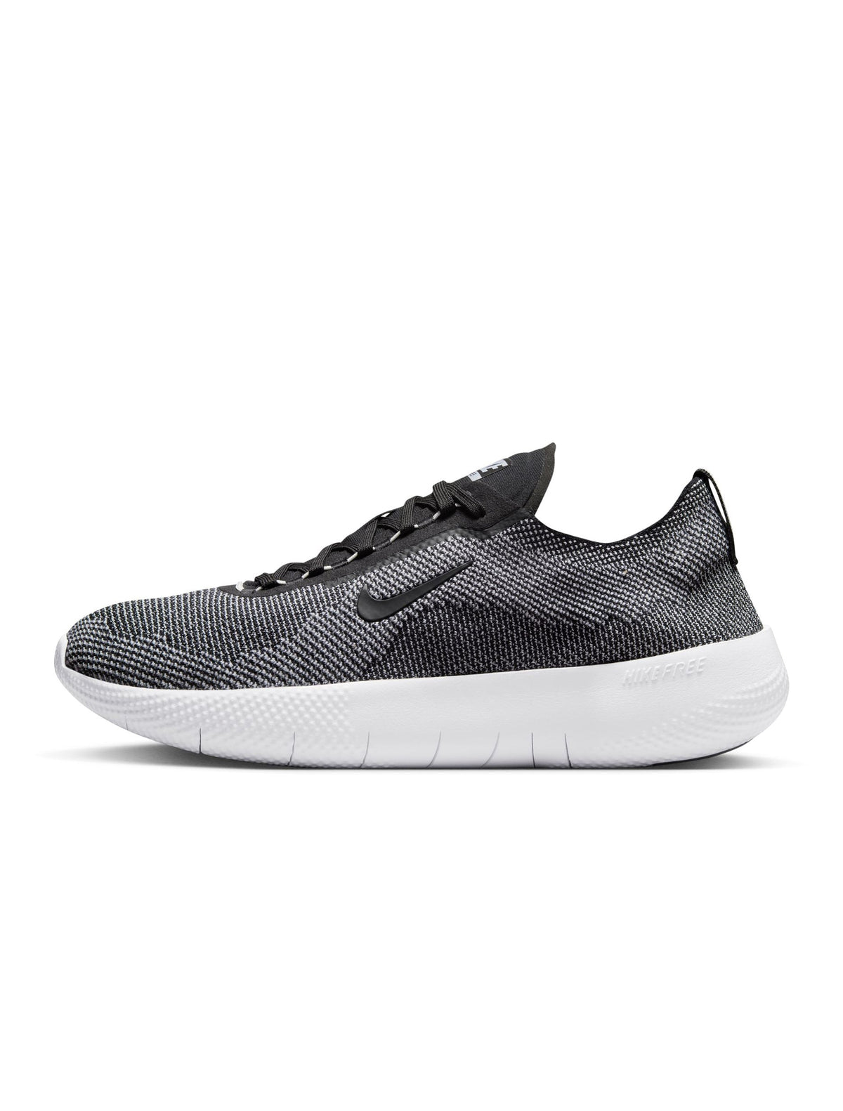 Nike men's Free 2025 sneakers in black and white, lightweight athletic footwear with a modern design.