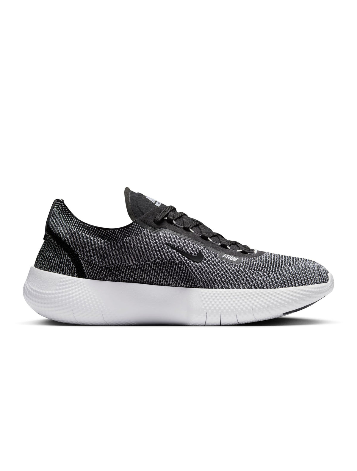 Nike men's Free 2025 black and white athletic footwear, shown in a sleek design with breathable mesh upper and cushioned sole.