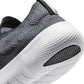 Nike men's Free 2025 sneakers in black and white, lightweight athletic footwear with breathable mesh and cushioned sole.