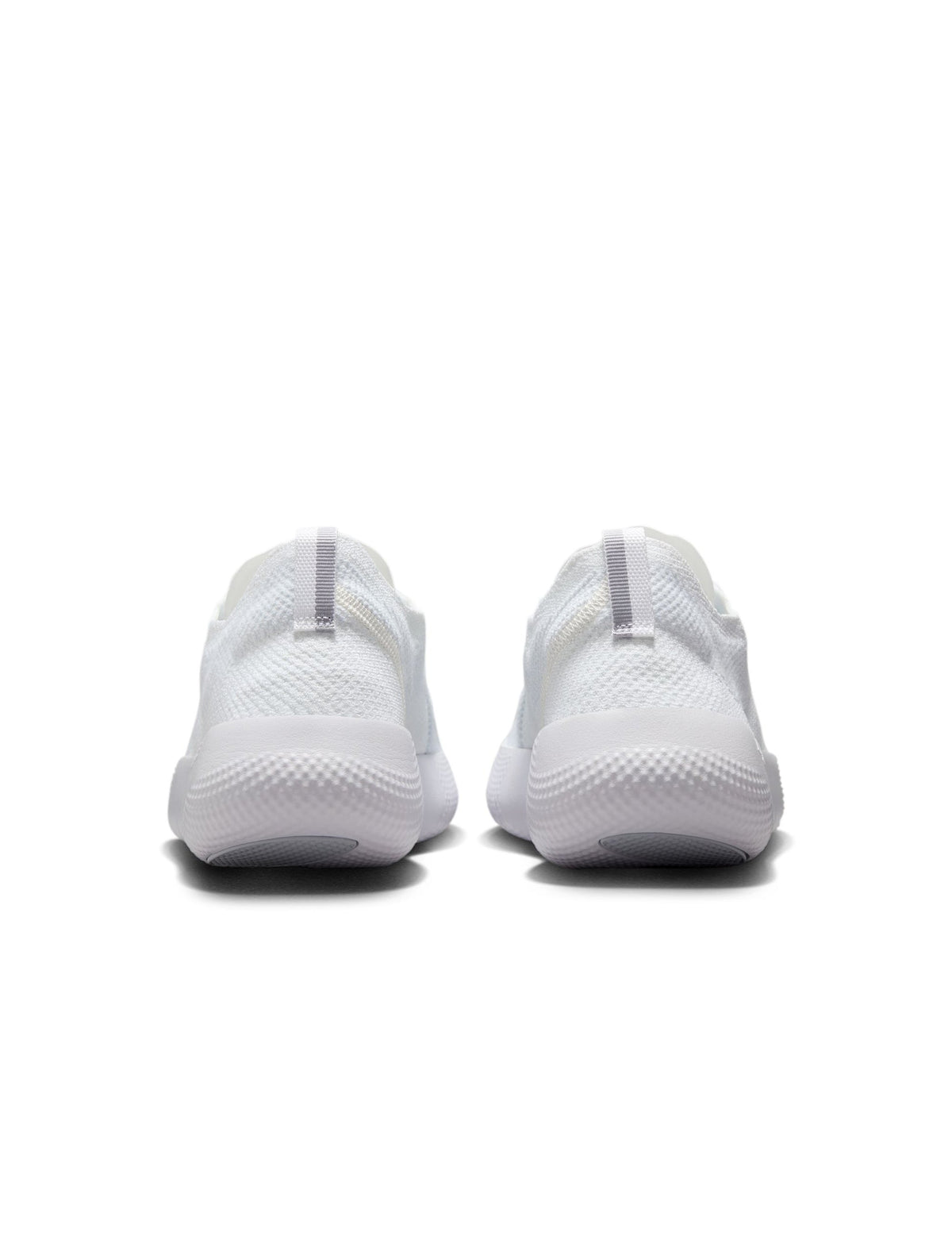 White Nike Men's Free 2025 sneakers with breathable mesh and lightweight design, displayed on a plain background.