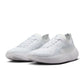 Nike men's Free 2025 white athletic shoes with breathable mesh and flexible soles, displayed on a plain background.