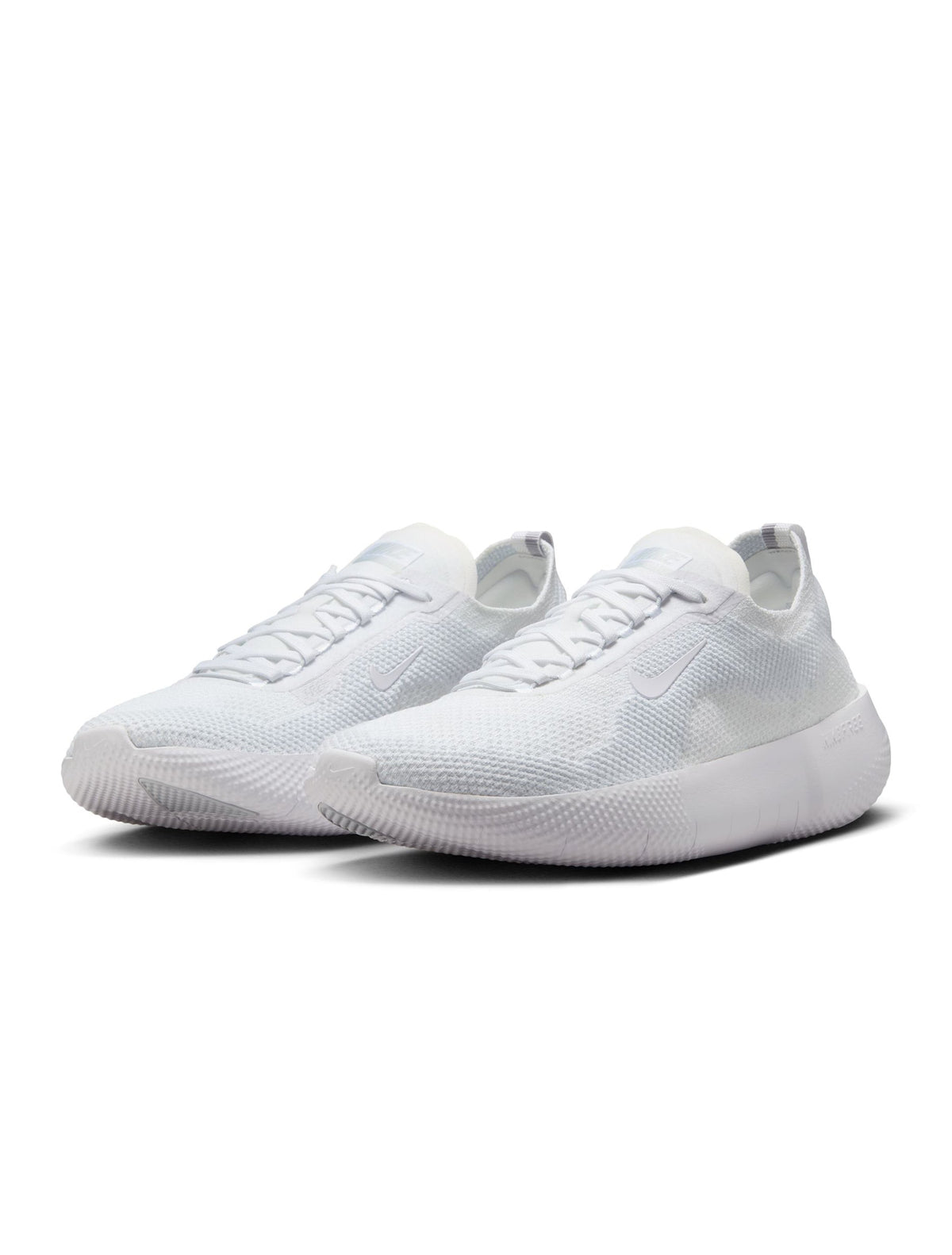 Nike men's Free 2025 white athletic shoes with breathable mesh and flexible soles, displayed on a plain background.