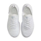 Nike men's Free 2025 white athletic shoes with breathable mesh and cushioned soles, featuring sleek design and Nike branding.