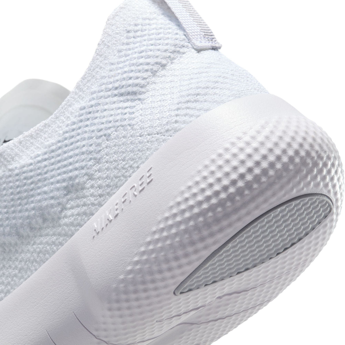Nike men's Free 2025 white running shoes, lightweight athletic footwear, featuring breathable design and cushioned sole.