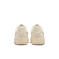 Nike Women's Air Force 1 Low sneakers in Coconut Milk color, stylish women's footwear with clean design and white accents.