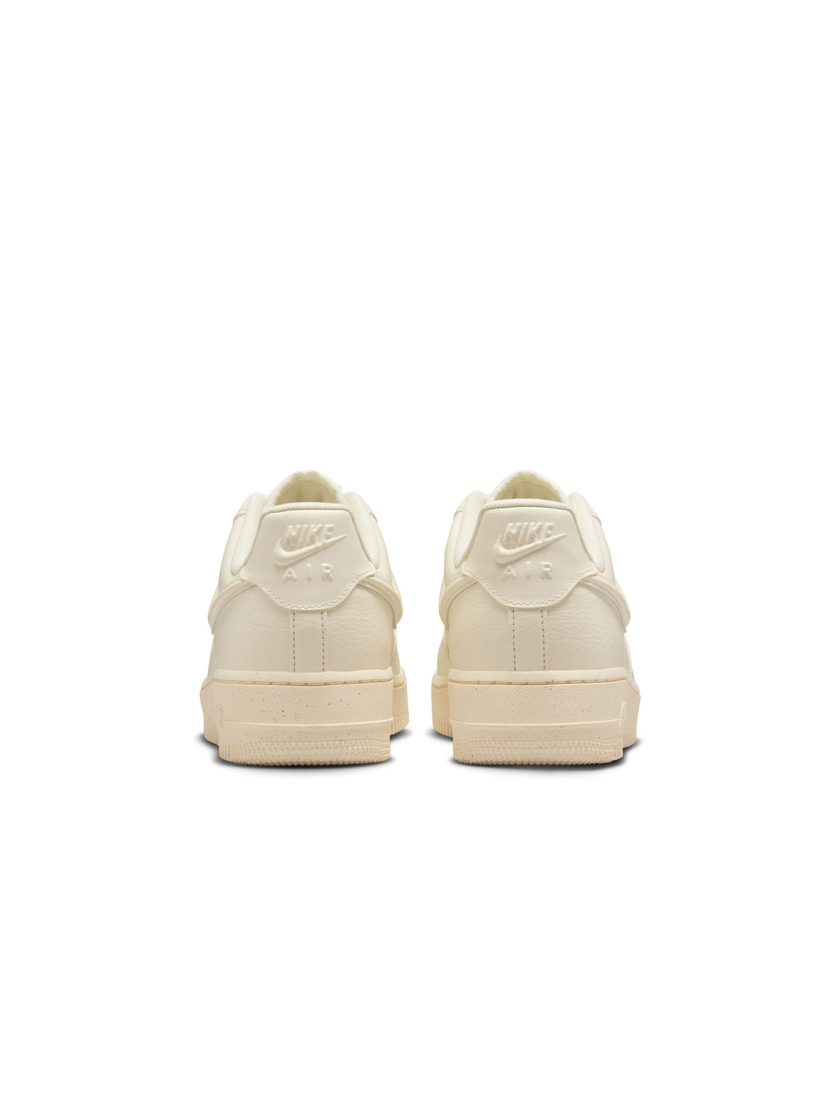 Nike Women's Air Force 1 Low sneakers in Coconut Milk color, stylish women's footwear with clean design and white accents.