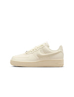 Nike Womens Air Force 1 Low sneakers in Coconut Milk colorway, featuring white leather and classic low-top design.