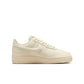 Nike Women's Air Force 1 Low sneakers in Coconut Milk color, featuring white leather and stylish design, on a clean background.
