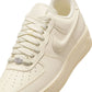 Nike Womens Air Force 1 Low sneakers in Coconut Milk color, featuring classic design and white leather upper.