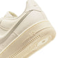 Nike Women's Air Force 1 Low sneakers in Coconut Milk color, shown in a close-up of the stylish women's footwear.