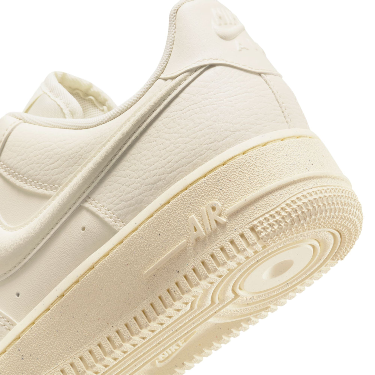 Nike Women's Air Force 1 Low sneakers in Coconut Milk color, shown in a close-up of the stylish women's footwear.