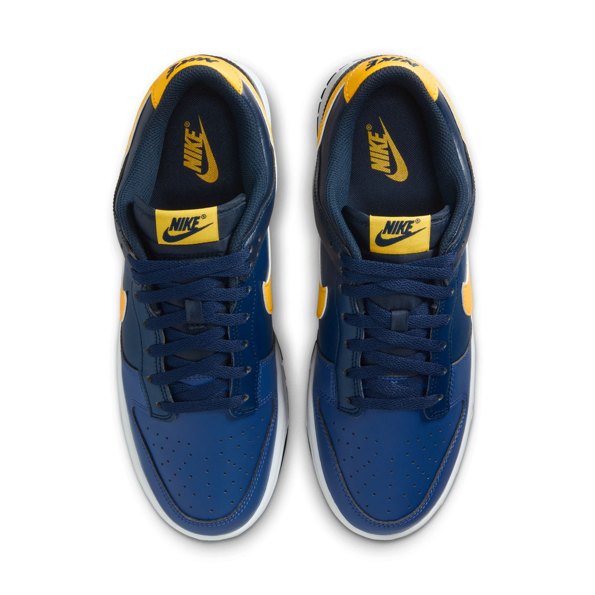 Nike men's Dunk Low Retro Blue Legend sneakers, featuring blue leather and white accents, on a neutral background.