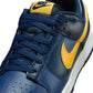 Nike Men's Dunk Low Retro Blue Legend sneakers in navy and white leather, featuring Nike branding and classic low-cut design.