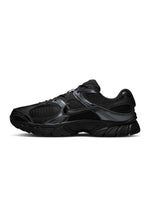 Nike men's V5 RNR black footwear showing sleek design and textured materials, ideal for casual or athletic wear.