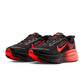 Nike men's Vomero 18 footwear in Black and Bright Crimson sneakers, side view