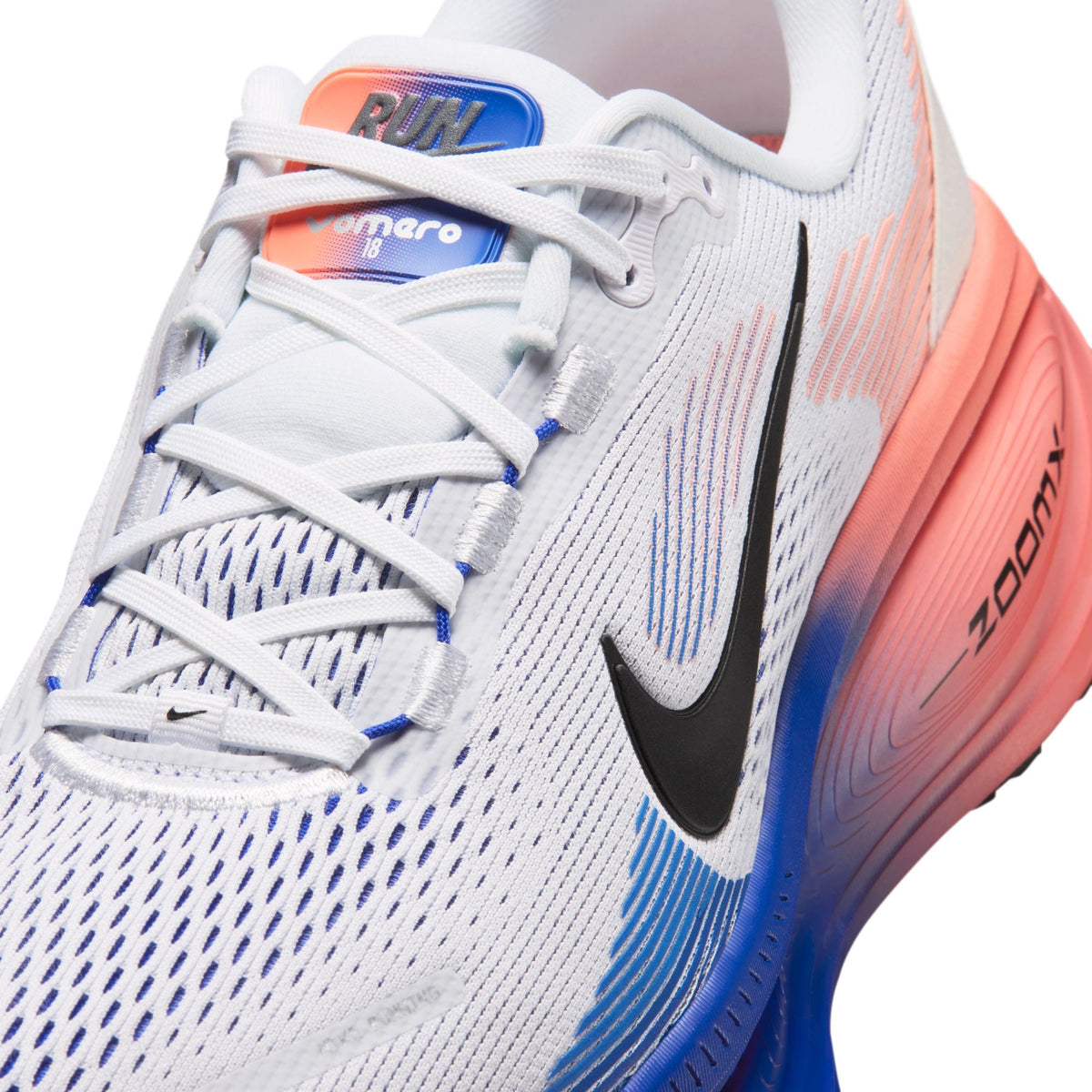 Nike Mens Vomero 18 running shoes in white and blue with cushioned soles and breathable mesh uppers.