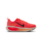 Nike Womens Vomero 18 running shoes in Hot Lava color, featuring breathable mesh and supportive cushioning.