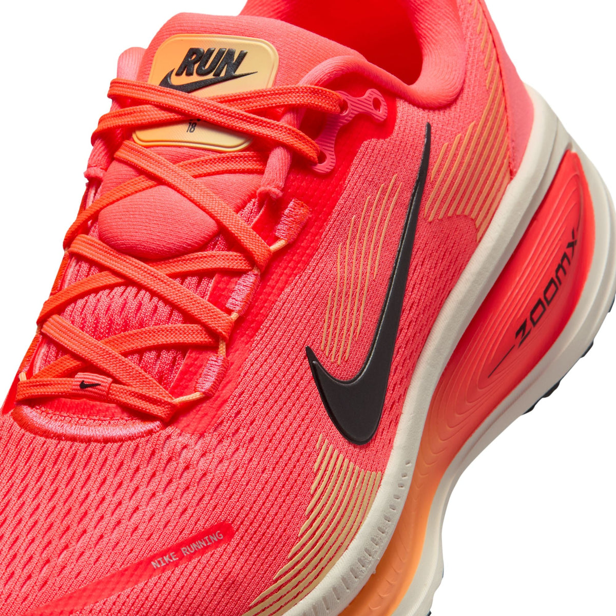 Nike Womens Vomero 18 Hot Lava running shoes, vibrant orange and pink athletic footwear for women, displayed on a plain background.