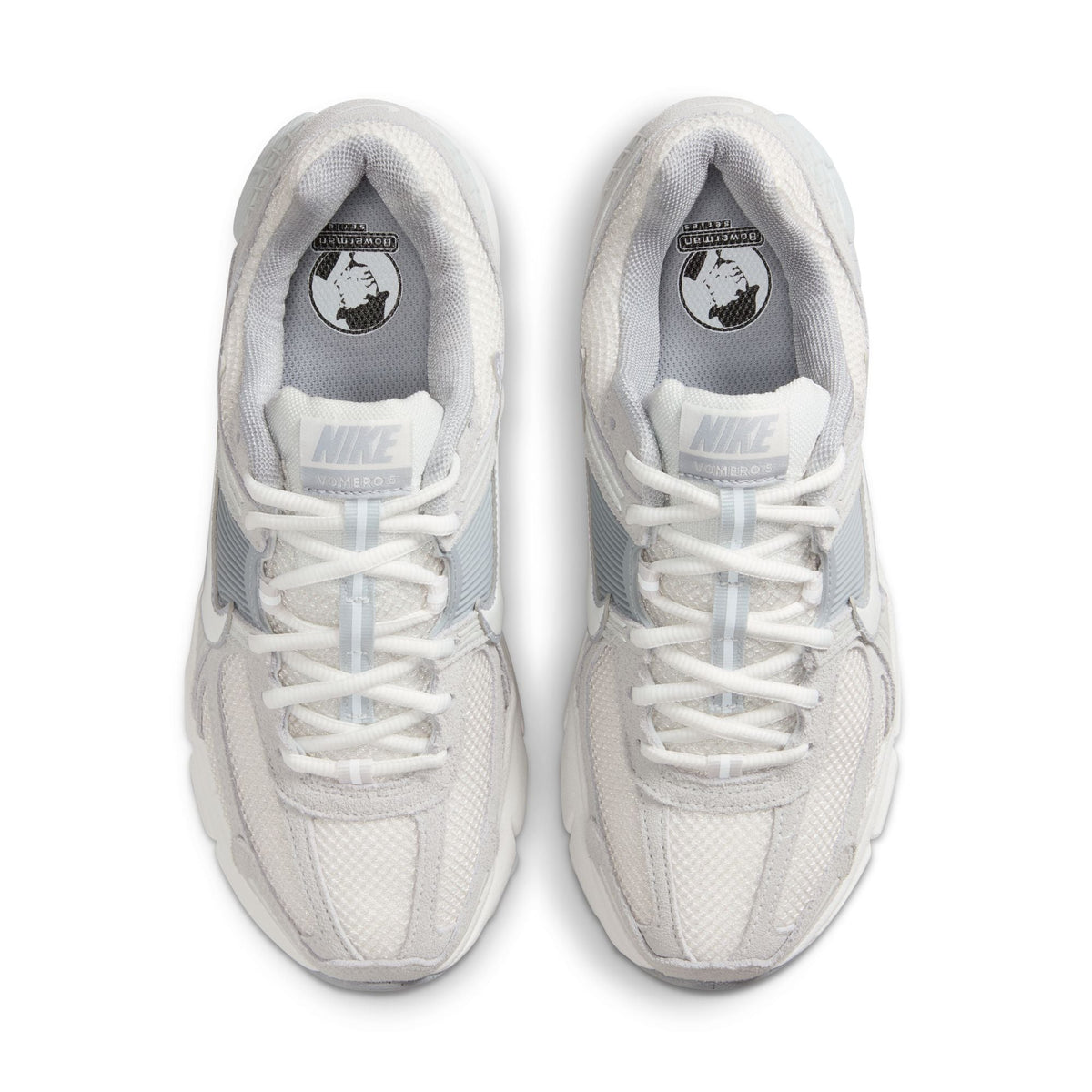 Nike Women's Zoom Vomero 5 sneakers in Pure Platinum color, featuring lightweight athletic design and breathable mesh upper.