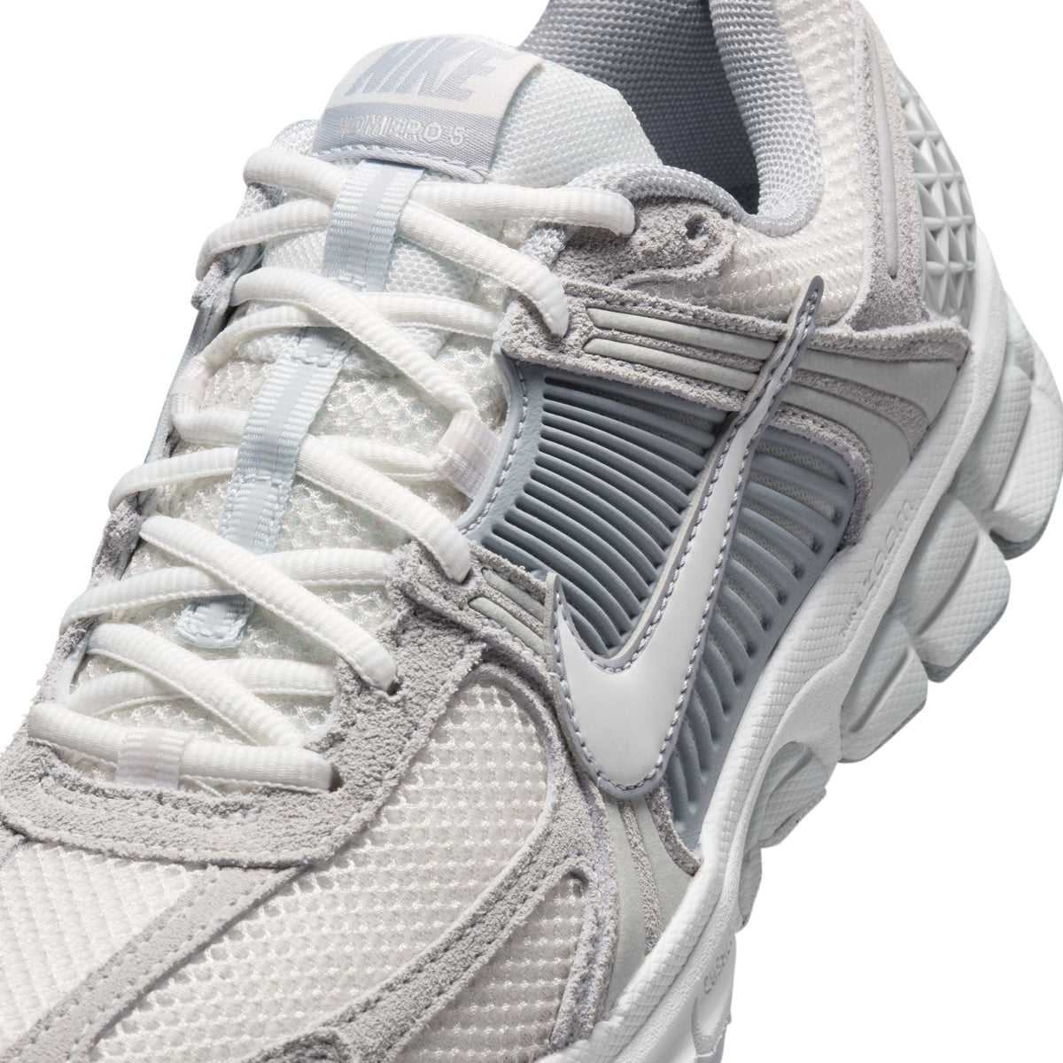 Nike Women's Zoom Vomero 5 running shoes in Pure Platinum with white and silver accents, designed for comfort and style.