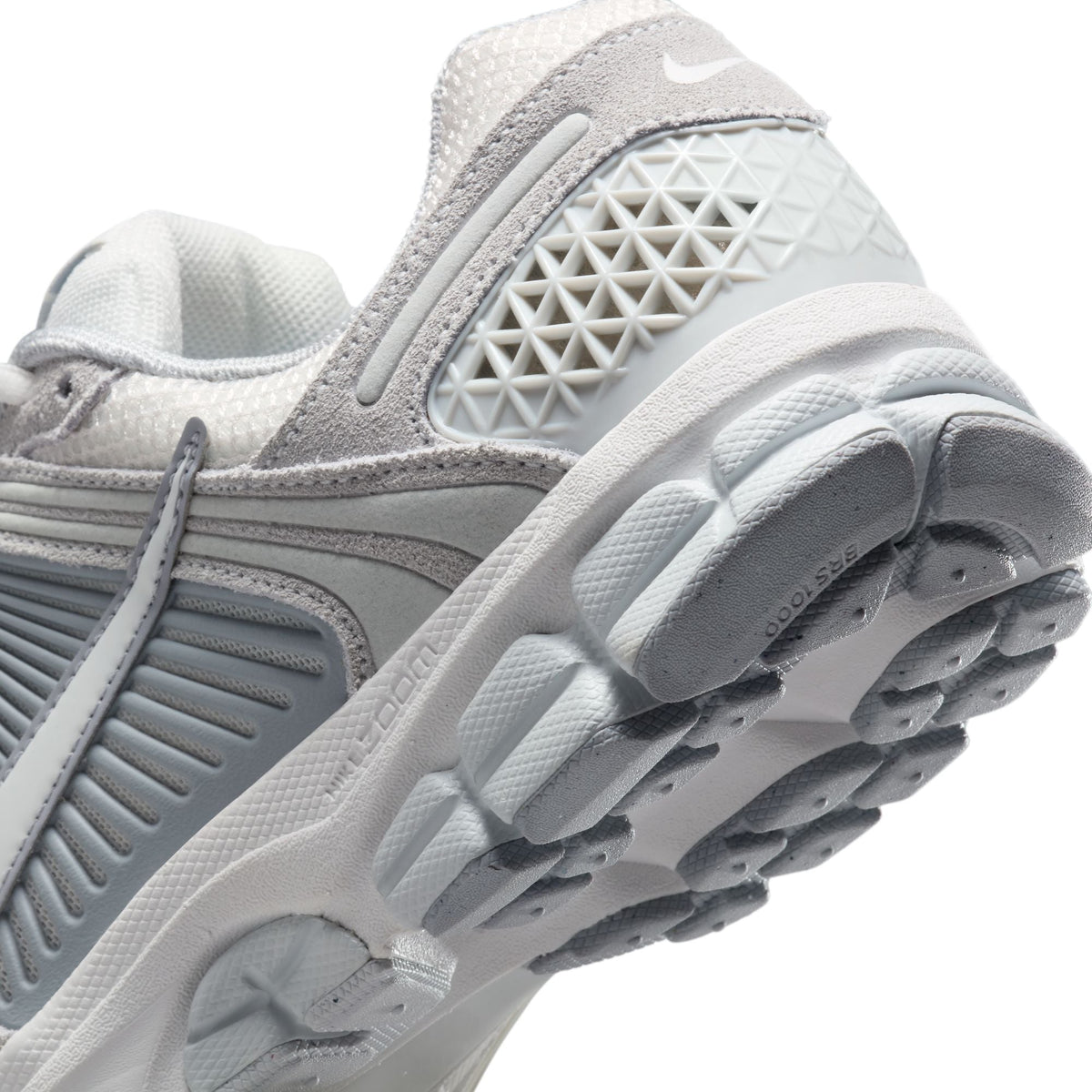 Nike Women's Zoom Vomero 5 running shoes in Pure Platinum color, featuring a sleek design and cushioned sole for comfort.