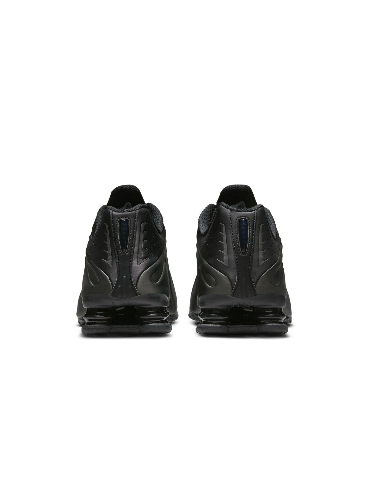 Men's Nike Shox R4 footwear in black with cushioned sole and sleek athletic design