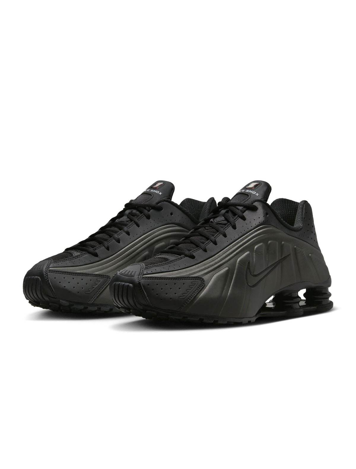 Black Nike Men's Shox R4 sneakers with cushioned heel columns from Denim Exchange