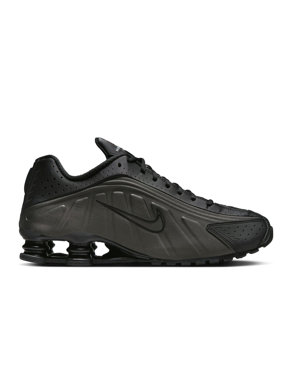 Black Nike Men's Shox R4 sneakers with signature shock-absorbing columns and sporty low-top design