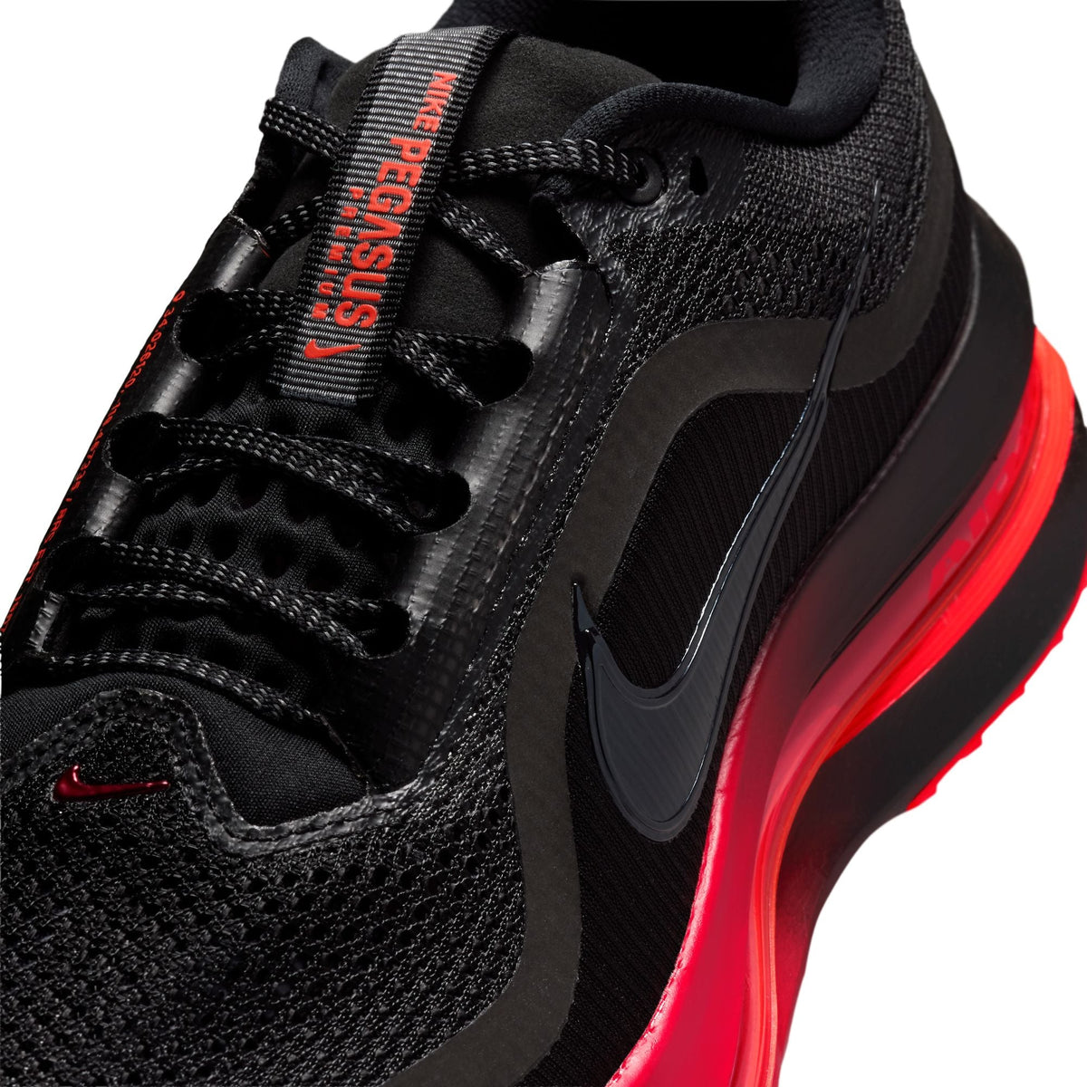 Nike men's Pegasus Premium running shoes in black with university red accents, featuring breathable mesh and cushioned soles.