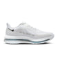 Nike men’s Pegasus Premium footwear in white with metallic silver details, side view