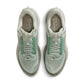 Nike men's Pegasus Premium sneakers in Jade Horizon green and black, displayed from the side